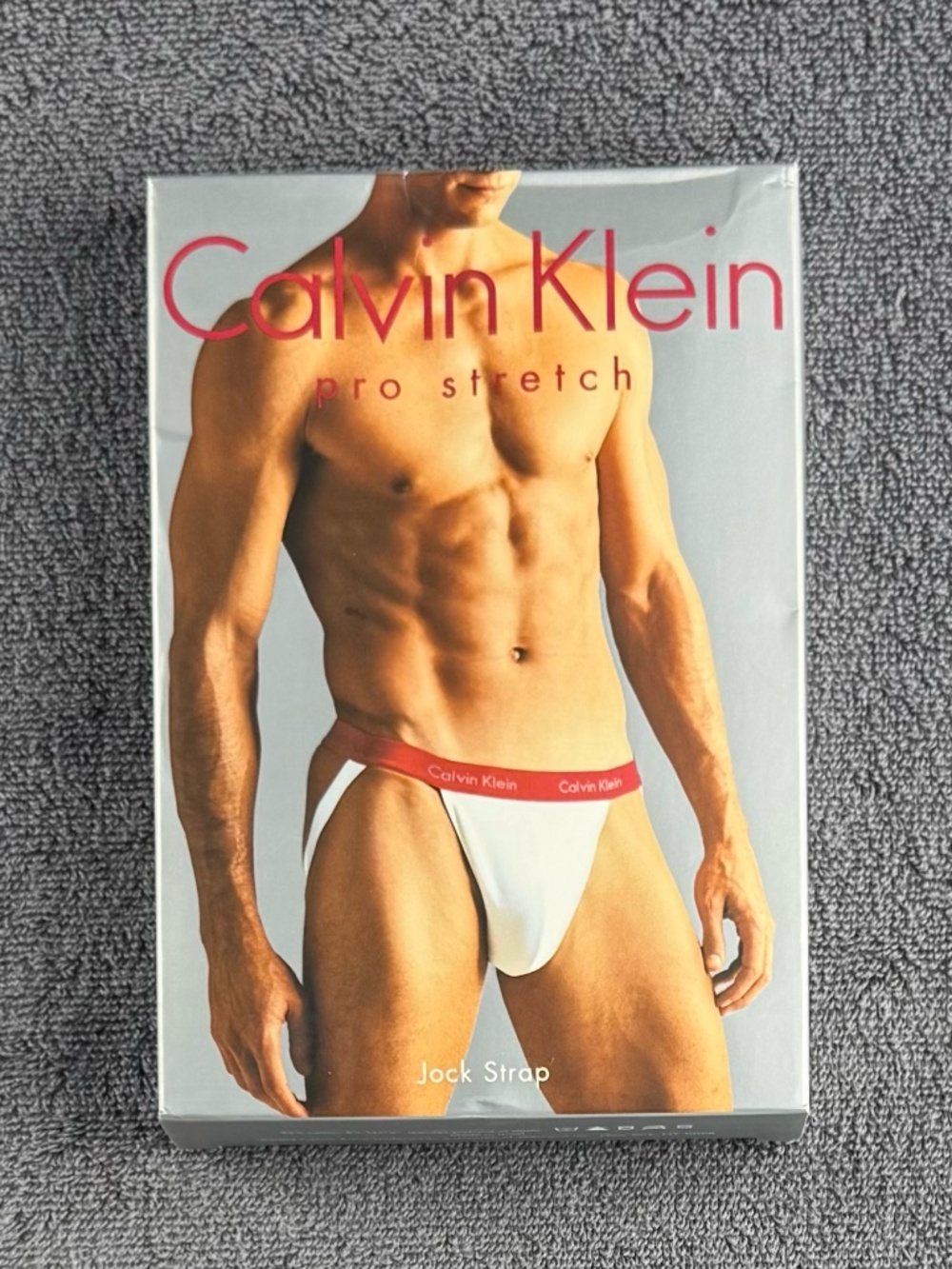 Vintage men's Calvin Klein Pro Stretch jockstrap - red waistband on white  body